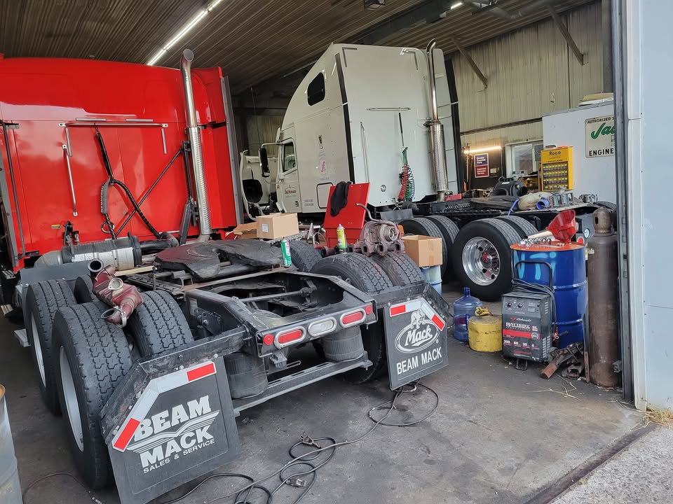 Trucks being serviced inside the Brennan Motorworks workshop
